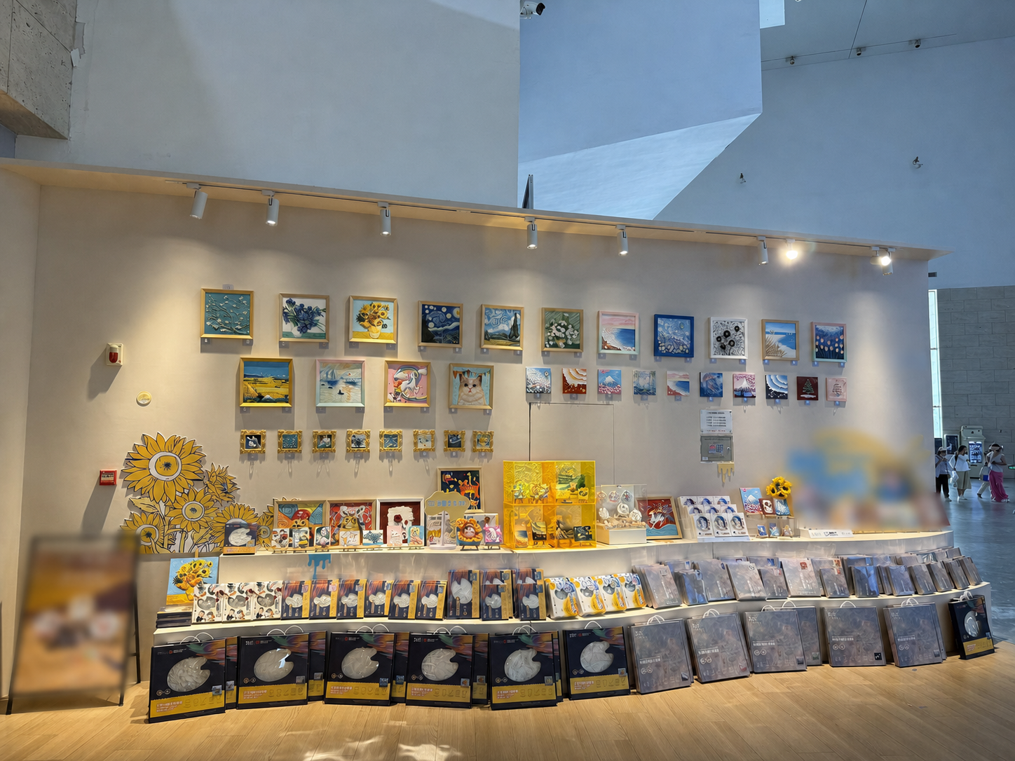 Relife relief artworks and boxed kits displayed in an art museum retail area